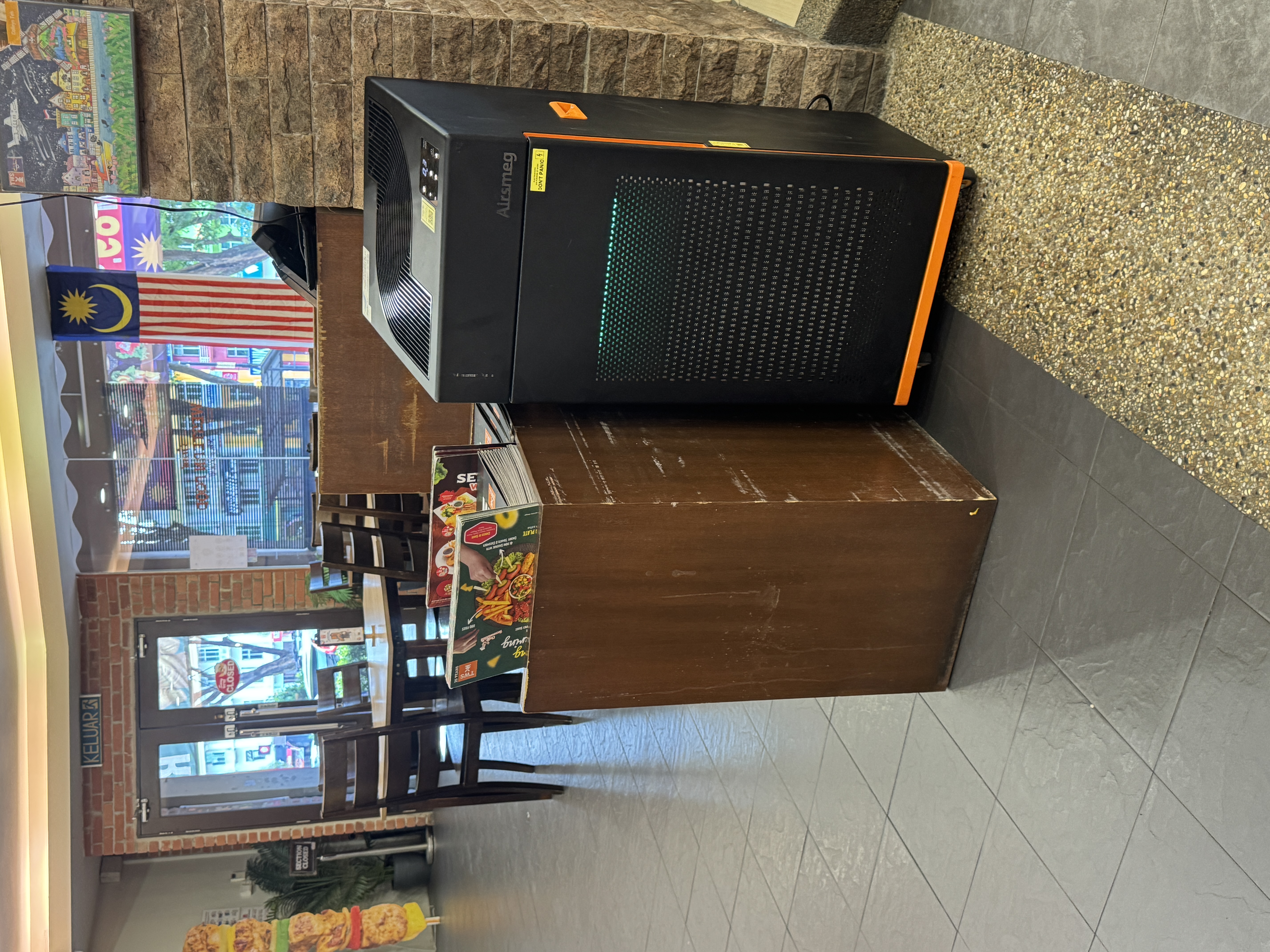 Airsmeg air purifier placed inside a restaurant